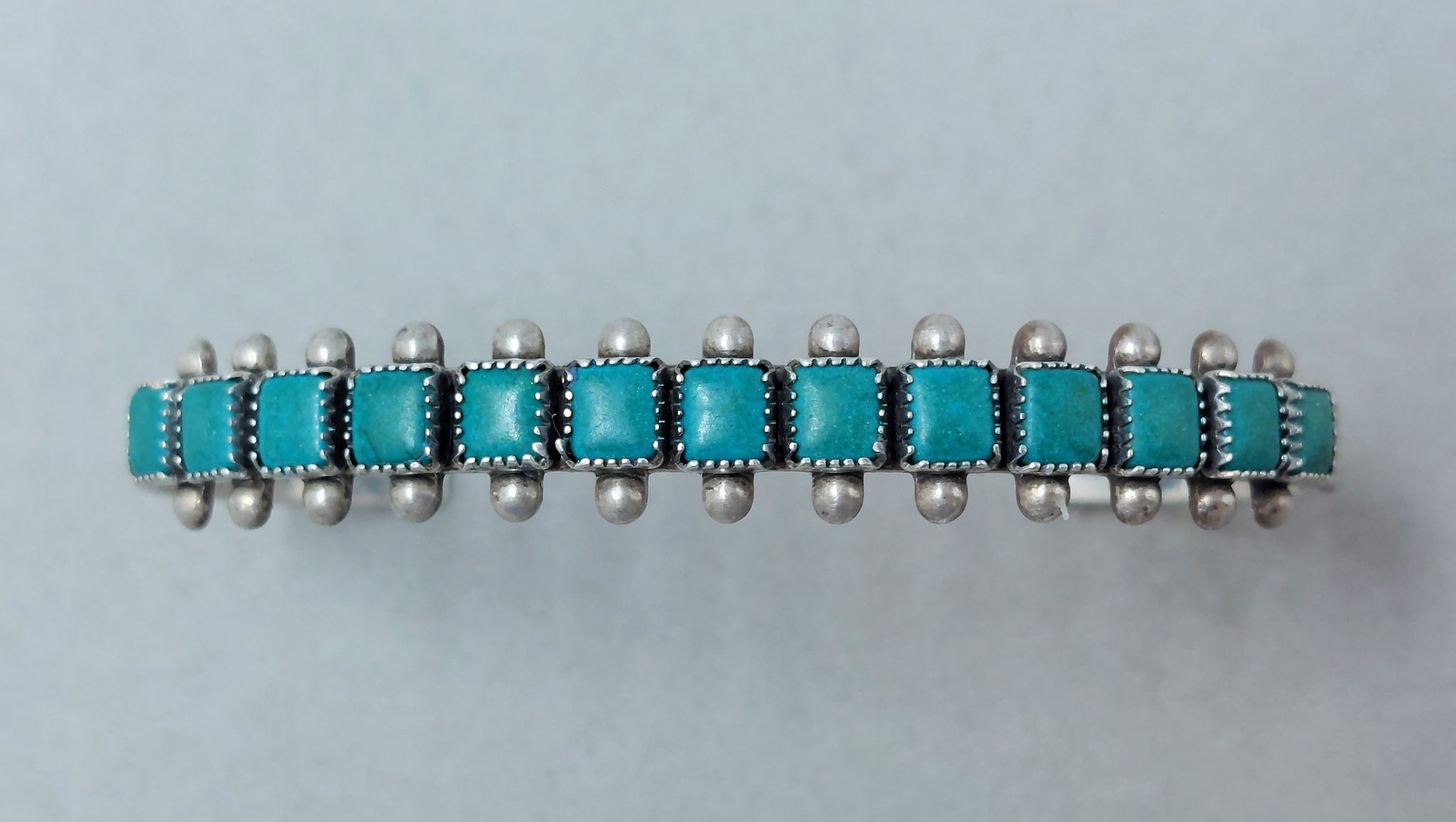 Navajo / Zuni Sterling Silver Narrow Single Row Turquoise Cuff