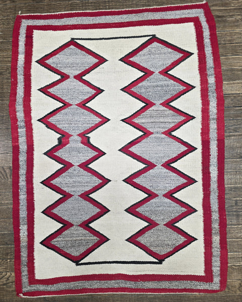 Native American Navajo rug exhibits a distinctive Eye Dazzler-influenced geometric design
