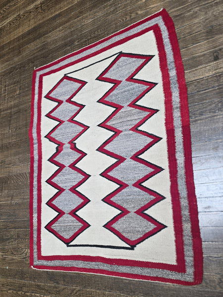 Native American Navajo rug exhibits a distinctive Eye Dazzler-influenced geometric design
