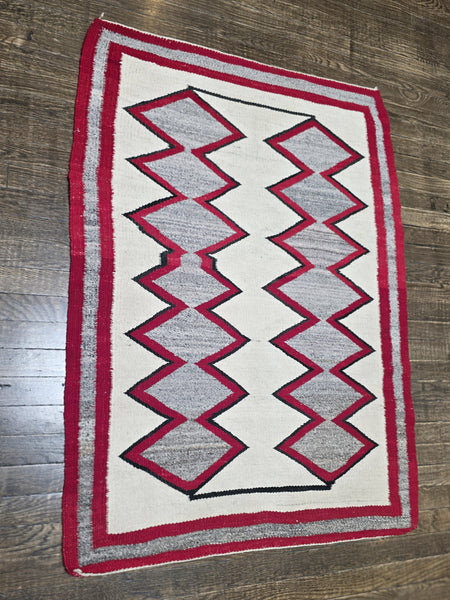 Native American Navajo rug exhibits a distinctive Eye Dazzler-influenced geometric design