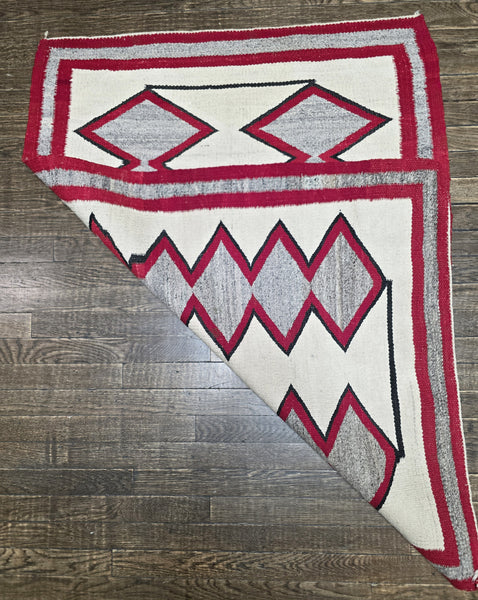 Native American Navajo rug exhibits a distinctive Eye Dazzler-influenced geometric design