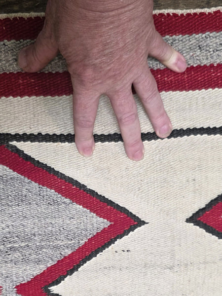 Native American Navajo rug exhibits a distinctive Eye Dazzler-influenced geometric design